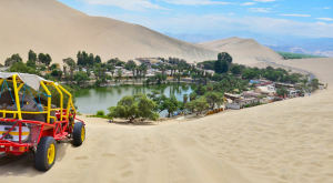 Huacachina oasis is a local attraction, surrounded by sand dunes